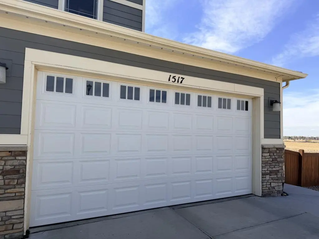 Garage Door Repair with garage door panel replacement service for damaged doors