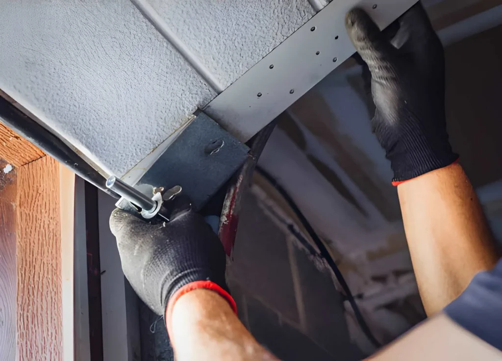 Professional technician performing Garage Door Maintenance on residential overhead door system